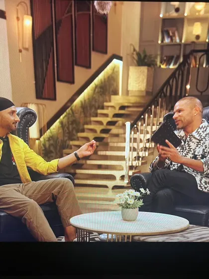 Another shot of Harbhajan Singh and Shikhar Dhawan during their conversation. The styling aimed to reflect their individual personalities while maintaining a cohesive look for the show.