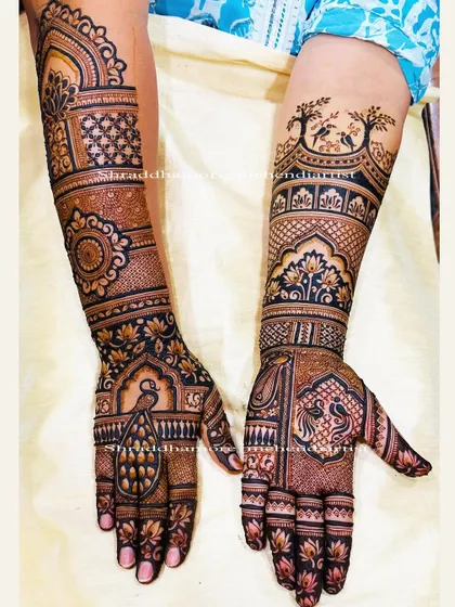A static, clear view of the full bridal mehendi, showing how the different themes on each arm create a cohesive and stunning overall design. Perfect for the bride who wants it all.
