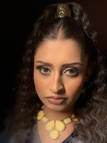 Another angle of this dramatic portfolio look, highlighting the sculpted features and bold eye makeup.
