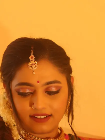 A close-up on the eye makeup for an engagement look. I used warm, shimmery tones with a soft wing to define the eyes without being too heavy, keeping the overall feel fresh and celebratory.