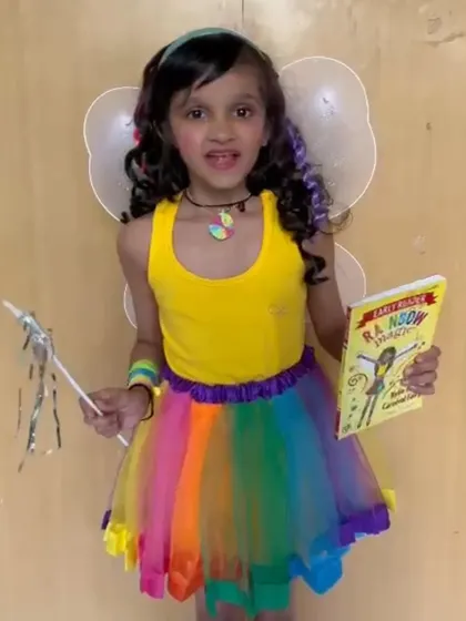 Dressed as a fairy, this student is ready for her "Share and Shine" presentation. We encourage creativity in all forms, and allowing kids to dress up makes speaking in class even more fun.
