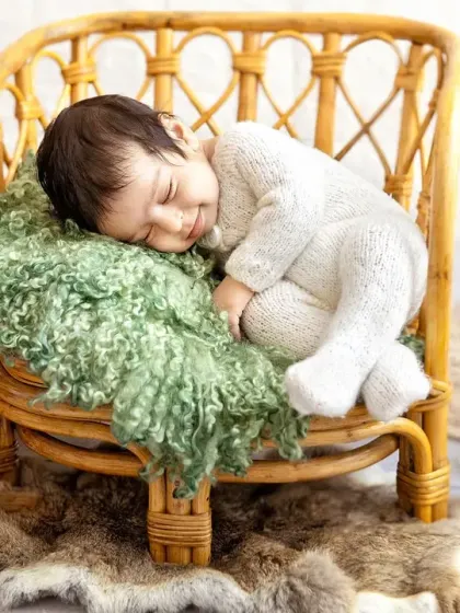 This pose shows just how tiny and curled up newborns are in their first few weeks. It's a classic and beautiful way to remember this stage.