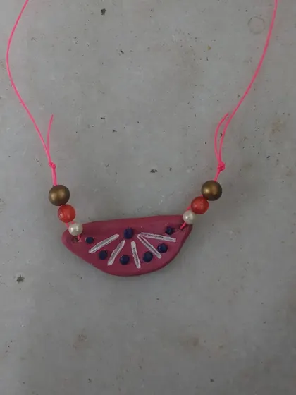 A beautiful clay pendant made for a school project. I guide students to create their projects themselves, as that is the best way to learn.