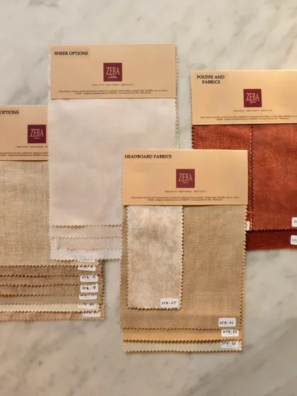 Our process begins with a conversation and a selection of textures and tones. These fabric swatches, prepared for a client, are the first step in a collaborative journey to create a space that feels uniquely personal and beautifully crafted.