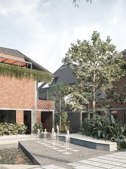 A central courtyard in the Kolgaon Masterplan, complete with a water feature and lush planting. These spaces break up the density of the housing and provide residents with beautiful, shared outdoor rooms.