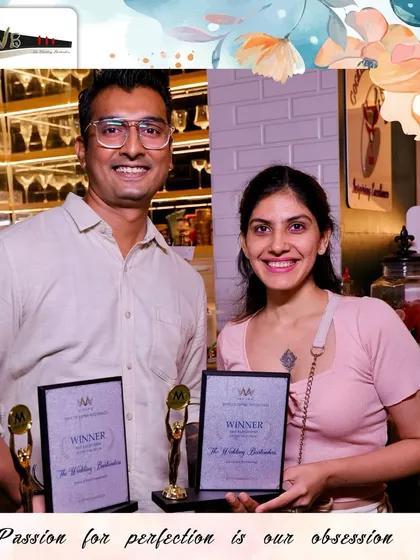 Our team members proudly displaying the winner's trophies from the Mpire Weddings awards.
