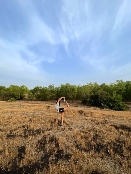 A reminder that it's a beautiful world out there. Practicing Purna NatarajAsana (Full Dancer's Pose) in a wide open field.