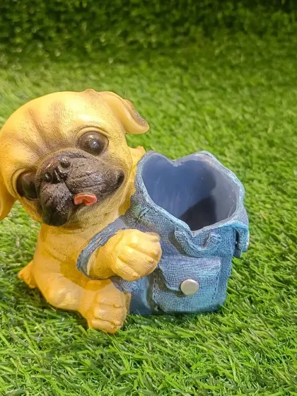 This pug pen holder is full of character, with its classic wrinkled face and a little denim backpack to hold your pens.