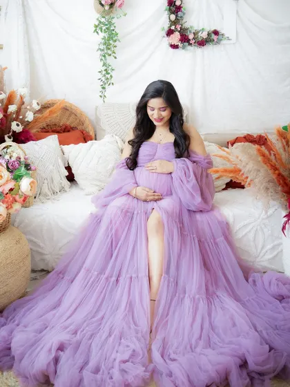 A duplicate of image 242, this dreamy portrait in a flowing lavender gown is set in a beautiful boho-inspired studio.