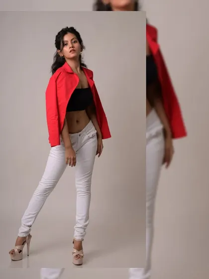 A bold and confident studio shot with a red jacket. The split image format shows off the full outfit and a dynamic pose.
