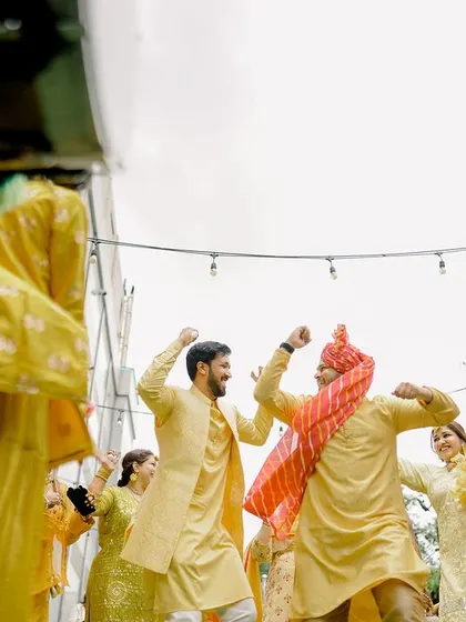 The groom's entrance, dancing with his friends and family to the beat of the dhol.