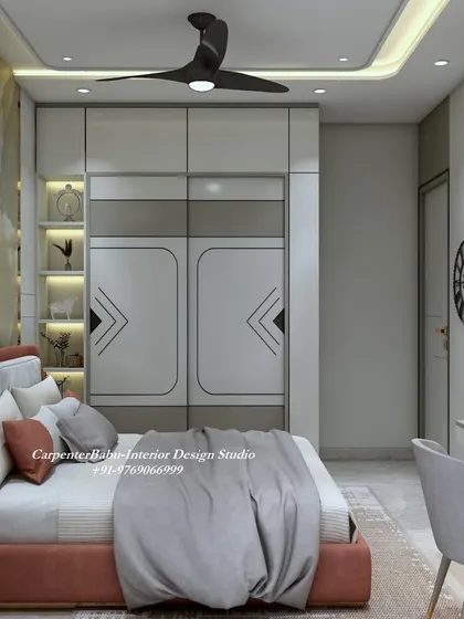 This bedroom uses a warm, terracotta color for the bed, which contrasts beautifully with the grey and white wardrobe. The built-in shelf in the wardrobe is a smart storage solution.