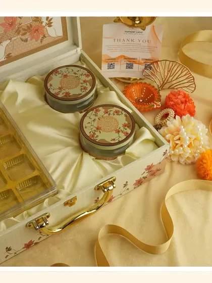 The contents of the "White Bliss" hamper, with the tray of sweets removed to show the two decorative tins more clearly.