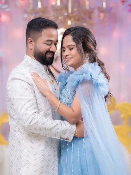 A fairytale moment for the newly engaged couple. Her gown and makeup create a look of pure elegance.