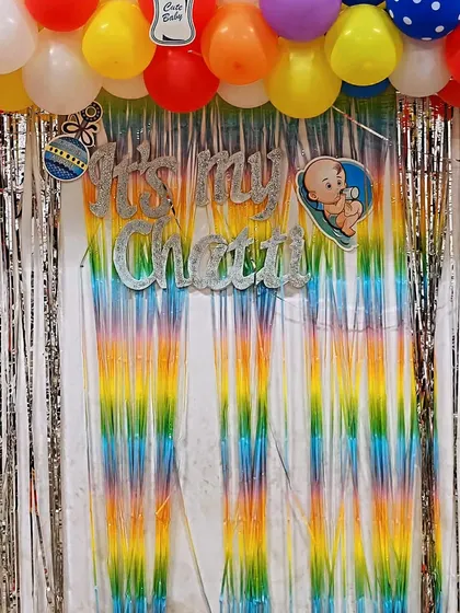A close-up of the "It's my Chatti" banner. The glittery letters and cute baby graphic add a personalized and festive touch to the traditional newborn celebration.