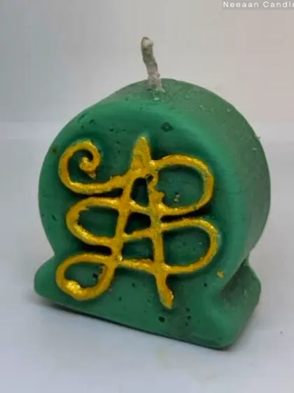 This is my Zibu symbol candle, designed for peace and healing. Zibu symbols are angelic symbols that carry beautiful energy, and I've embossed this one in gold for extra light.