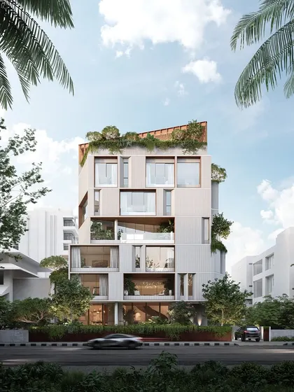 This is a vision for a mid-rise coastal residence in Mumbai. The design is a carved volume with integrated planters and framed openings, creating a dialogue with the sea while modulating privacy, light, and ventilation for urban living.