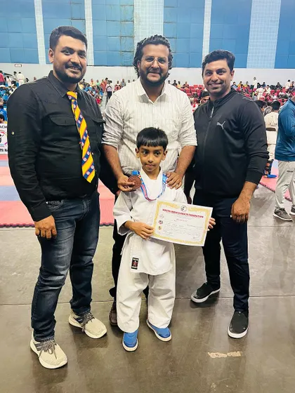 With my student and son, Hasnain, alongside AKSKA officials after his bronze medal win at the South India tournament.