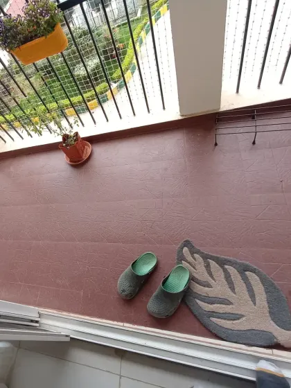 This image shows the balcony before I began the installation. The plain, tiled floor was functional but lacked warmth and character.