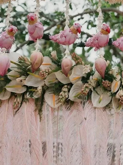An artistic floral detail featuring parrot motifs made from pink lotus petals, showcasing our creative craftsmanship.