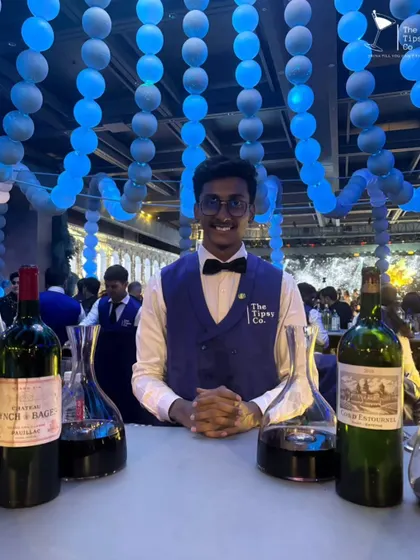 Our dedicated wine expert at a special event. We offer specialized services, including sommeliers who can guide guests through a selection of fine wines.
