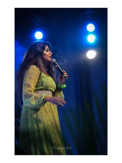 A side profile shot during a performance, showing the focus and passion I bring to every song.