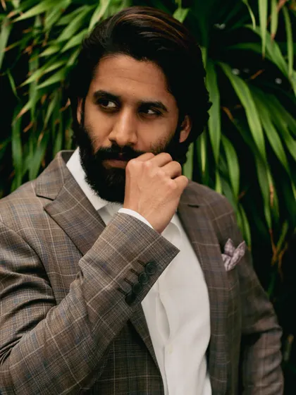 A close-up of Naga Chaitanya's award-winning look. The subtle check pattern of the Canali blazer and the crisp white shirt create a refined and elegant combination.