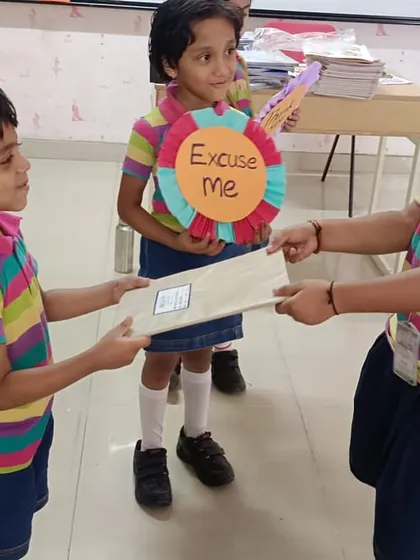 Students practice exchanging items politely using 'Excuse Me', reinforcing the importance of good manners in daily interactions.