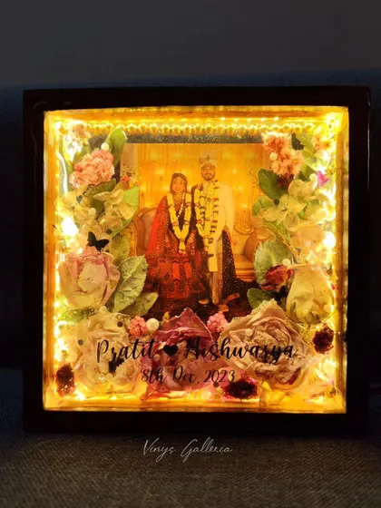 The lighted frame in a dark room, showcasing its magical and romantic glow.