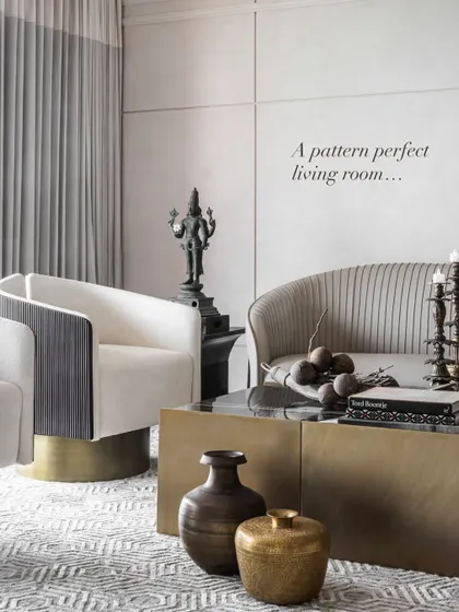 A pattern-perfect living room that is a study in restrained elegance. We believe in layering textures, clean forms, and quiet luxury to create a space that feels both timeless and lived-in. Here, a pleated sofa, a brass-finished coffee table, and an ancestral bronze statue come together in quiet harmony.