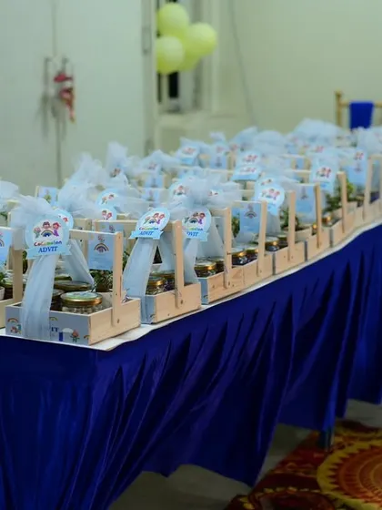 A long table displaying all the thoughtfully prepared party favors for the guests.