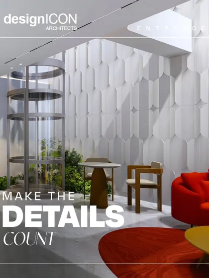 Details matter. This entrance area features a unique cylindrical glass elevator, sculptural wall panels, and a pop of color with a vibrant red sofa, making a bold and artistic statement right from the start.