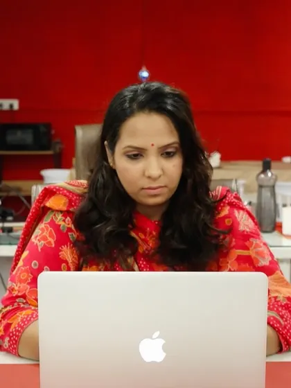 A typical day at the office, with our team member focused on her work. This shows the dedication that goes into every project.
