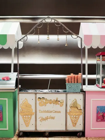 Food stalls are a great addition to any party. Here are custom designed carts for sushi, Turkish ice cream, and popcorn, all matching the party's theme.