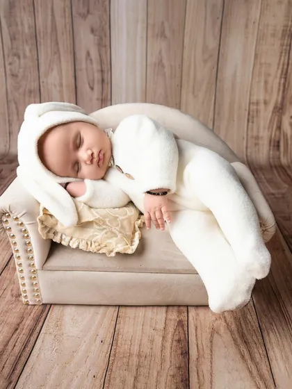 Sleeping peacefully in dreamland. I use simple props like this miniature bench to create a timeless and adorable scene for your newborn.