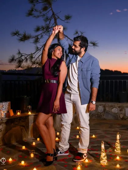 A romantic dance under the stars, on a patio decorated with candles and rose petals. A perfect fairytale moment.