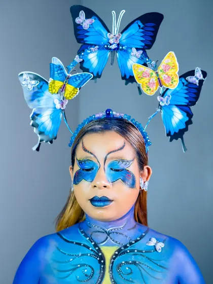 A full view of the completed butterfly fantasy makeup, showcasing the detailed body art on the chest and face. This level of artistry is taught in my advanced makeup courses.
