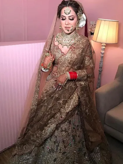 A full shot of the bride looking absolutely graceful in her traditional bridal attire.