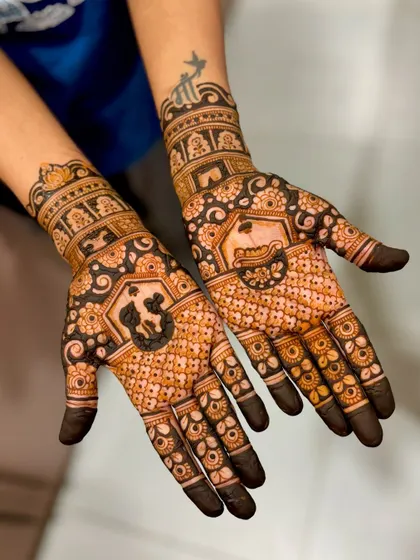 A crossed-hands view of Kratika's symbolic mehendi, showing the beautiful symmetry.