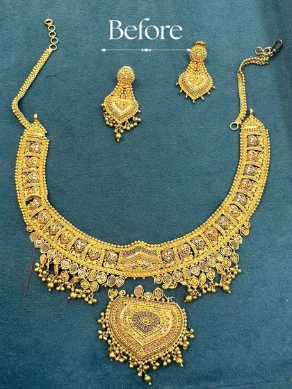 The 'Before' of a transformation. This was a classic gold necklace set with a heart-shaped pendant, a beautiful piece on its own but ready for a modern update.