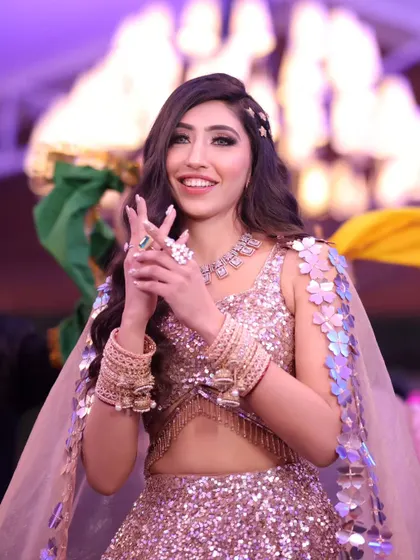 A beautiful, happy portrait of the bride-to-be during her engagement celebration, capturing her stunning outfit and joyful expression.