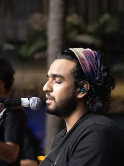 Our guitarist, lost in the music. The concentration and passion of our artists are what make our live band so special.