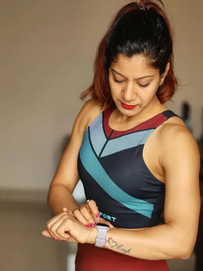 Time is of the essence, especially for a fitness freak! A fitness watch is a priced possession for tracking performance and planning workouts. Here, I'm checking my stats on my Garmin.