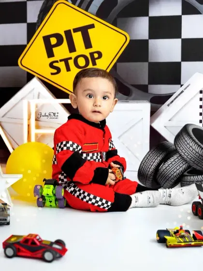 A moment of calm amidst the racing fun. These sitter sessions allow for a variety of poses, from playful action shots to sweet, seated portraits.