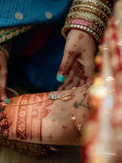 A close-up of the rich stain on the bride's feet, adorned with a beautiful payal. The deep color is the result of my high-quality, natural henna.