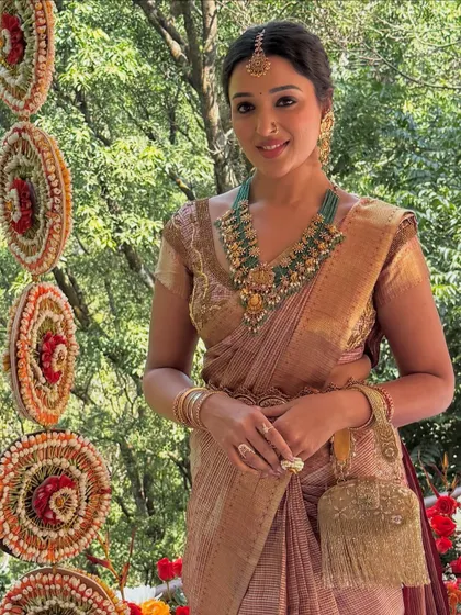 A beautiful shot of the bride in her traditional silk saree. My draping ensures the pleats are perfect and the pallu falls gracefully.