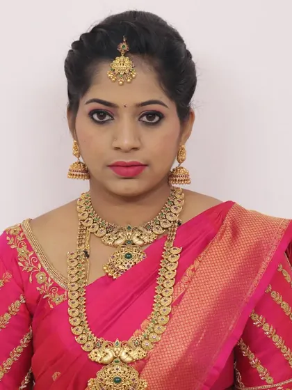 A classic party makeup look with a traditional touch. The makeup features a sharp winged liner and a pink lip, paired with antique gold jewelry for an elegant finish.