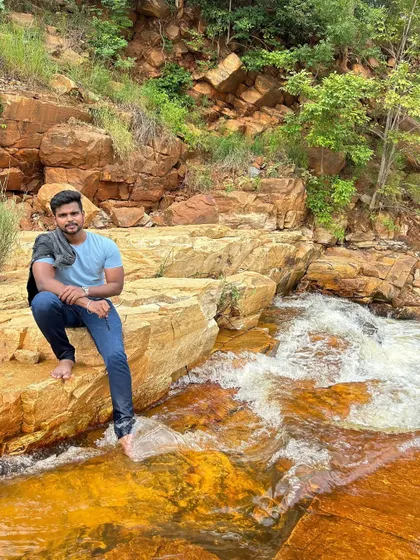 Taking a moment to relax by the flowing water.