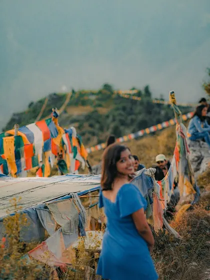 A candid moment from my time in Mussoorie, enjoying the mountain views and the vibrant prayer flags.