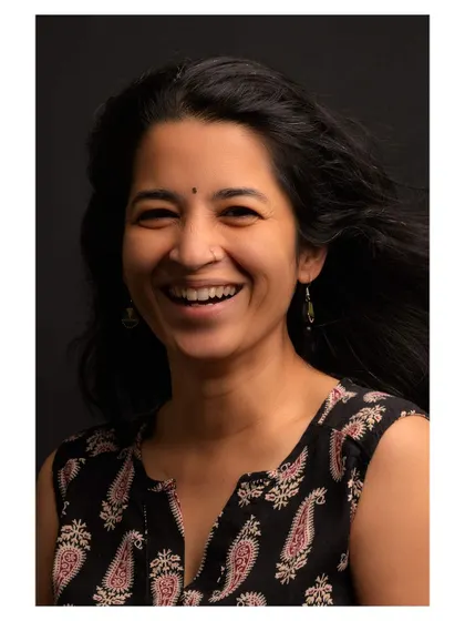 Another take from the same studio session, capturing a slightly different but equally joyful expression.